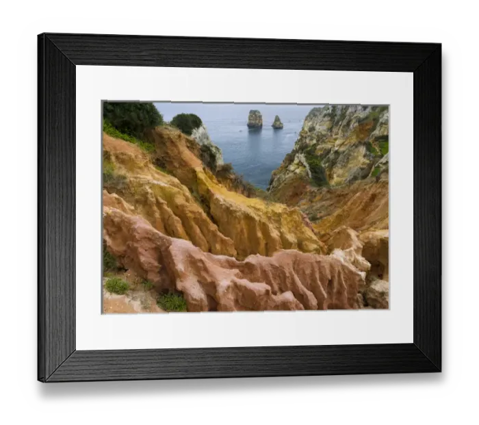 Framed Print : The cliffs and sea stacks of Ponta da Piedade at the rocky coast of the Algarve in Portugal Framed Print : The cliffs and sea stacks of Ponta da Piedade at the rocky coast of the Algarve in Portugal