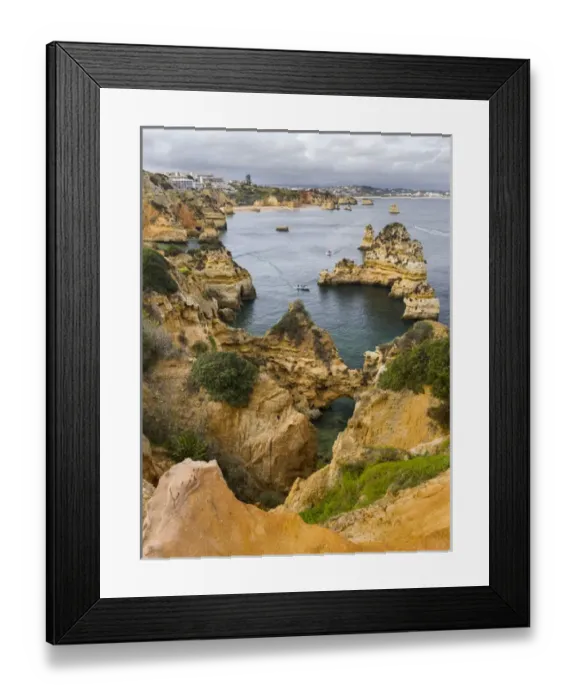 Framed Print : The cliffs and sea stacks of Ponta da Piedade at the rocky coast of the Algarve in Portugal Framed Print : The cliffs and sea stacks of Ponta da Piedade at the rocky coast of the Algarve in Portugal