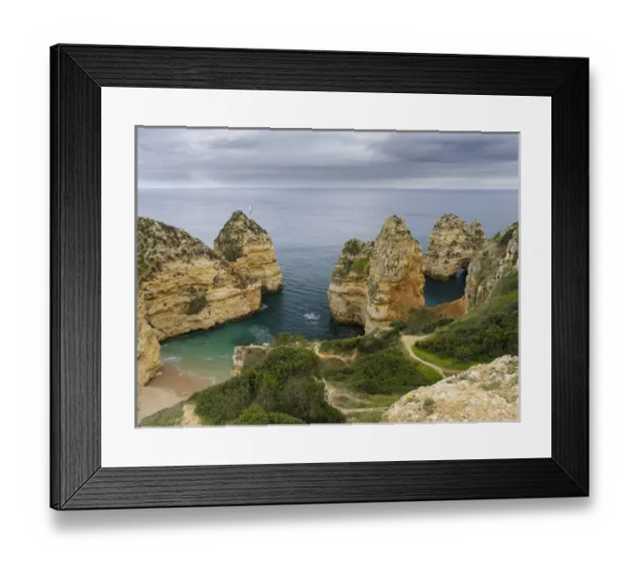 Framed Print : The cliffs and sea stacks of Ponta da Piedade at the rocky coast of the Algarve in Portugal Framed Print : The cliffs and sea stacks of Ponta da Piedade at the rocky coast of the Algarve in Portugal