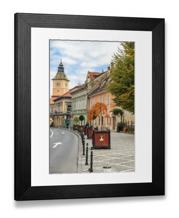 Framed Print : Europe, Romania, Brasov, Street scene from Council Square. Clock tower Framed Print : Europe, Romania, Brasov, Street scene from Council Square. Clock tower