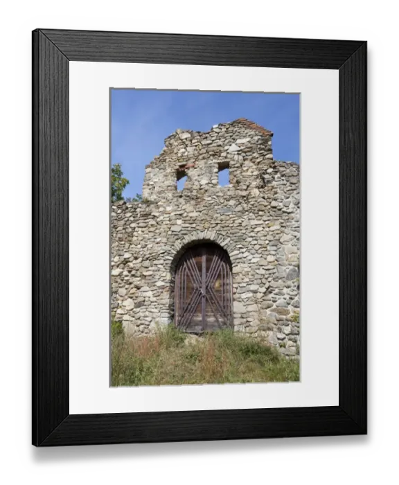 Framed Print : the romanic church of Cisnadioara with walls to defend the church and the citizens