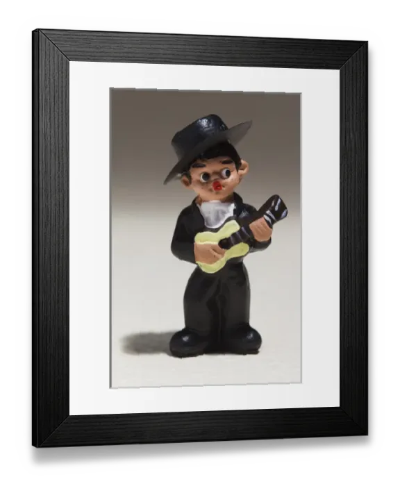 Framed Print : Spain, Madrid, souvenir miniature figurine of Spanish musician