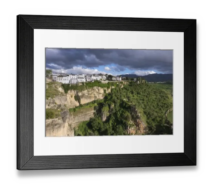 Framed Print : Spain, Andalusia. Ronda perches on the rugged defensible limestone cliffs Framed Print : Spain, Andalusia. Ronda perches on the rugged defensible limestone cliffs
