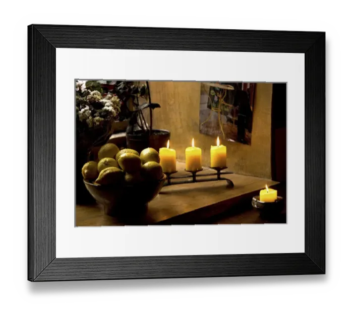 Framed Print : Europe, Estonia, Tallinn. Still life with lighted candles and bowl of lemons inside coffee shop