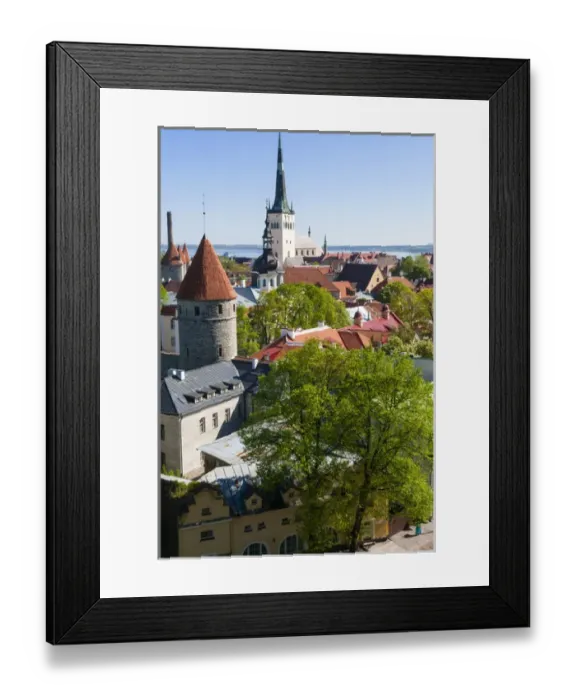 Framed Print : Medieval town walls and spire of St. Olavs church, view of Tallinn from Toompea hill