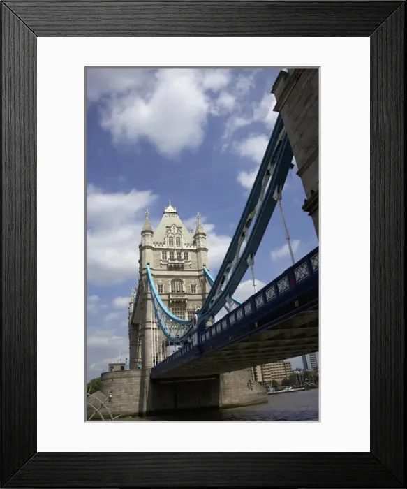 Framed Print : The Tower Bridge in London, England on a beautiful day with blue clouds and white Framed Print : The Tower Bridge in London, England on a beautiful day with blue clouds and white