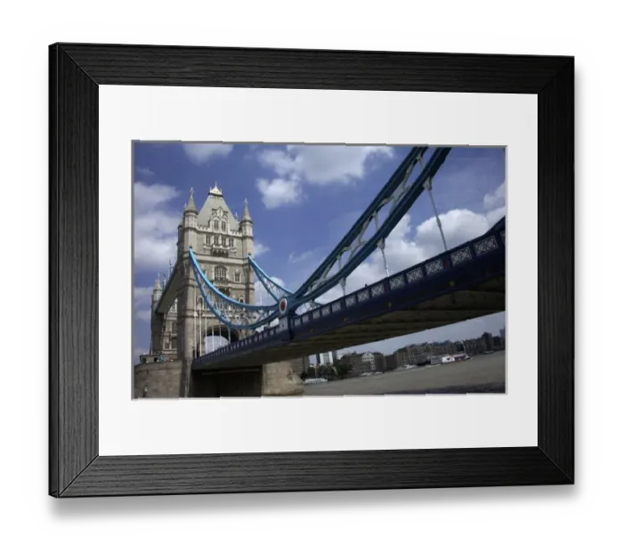 Framed Print : The Tower Bridge over the Thames River in London, England on a beautiful day with blue clouds Framed Print : The Tower Bridge over the Thames River in London, England on a beautiful day with blue clouds