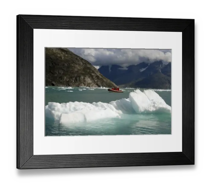 Framed Print : Greenland, Qooroq Fjord. A rubber raft navigates through a sea of icebergs on Qooroq Framed Print : Greenland, Qooroq Fjord. A rubber raft navigates through a sea of icebergs on Qooroq