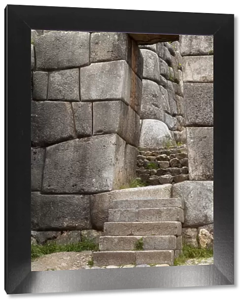 South America, Peru, Cuzco. Inca stone walls, stairs and door at Fort Sacsayhuaman ruins