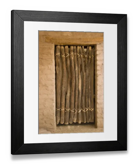 Framed Print : USA, Arizona, Tucson. Door made of wood poles and leather thongs in adobe wall Framed Print : USA, Arizona, Tucson. Door made of wood poles and leather thongs in adobe wall