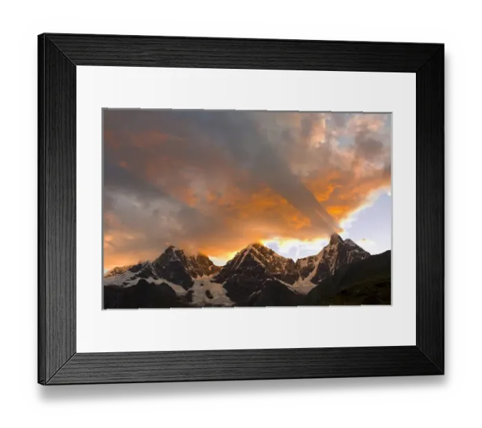 Framed Print : God rays, Crepuscular rays, clouds, and mountain peaks at sunset, Yerupaja, Grande and Chico to left Framed Print : God rays, Crepuscular rays, clouds, and mountain peaks at sunset, Yerupaja, Grande and Chico to left