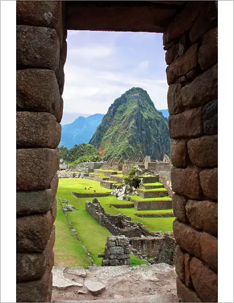View through window of the ancient lost city of the Inca, Machu Picchu, Peru, South