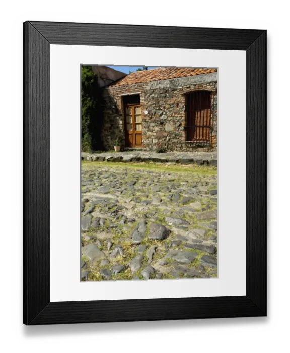 Framed Print : Uruguay. Colonia del Sacramento. Very rough cobblestone streets of the old colonial Framed Print : Uruguay. Colonia del Sacramento. Very rough cobblestone streets of the old colonial