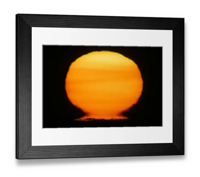 Framed Print : USA, Alaska, Homer. Sun at sunset distorts to look like a nuclear fireball. Credit as Framed Print : USA, Alaska, Homer. Sun at sunset distorts to look like a nuclear fireball. Credit as