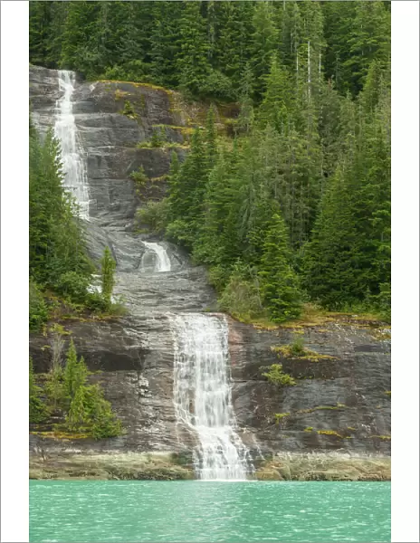 USA, Alaska, Endicott Arm. Mountain waterfall into ocean