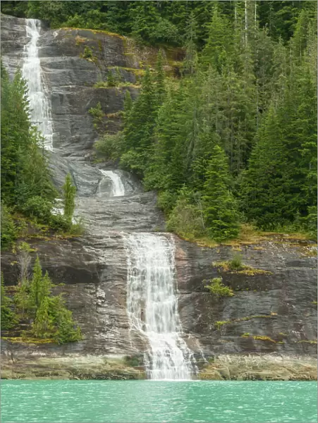 USA, Alaska, Endicott Arm. Mountain waterfall into ocean