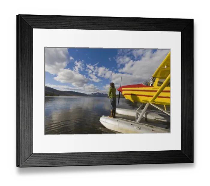 Framed Print : A fisherman on a floatplane in scenic Takahula Lake located along the National Wild