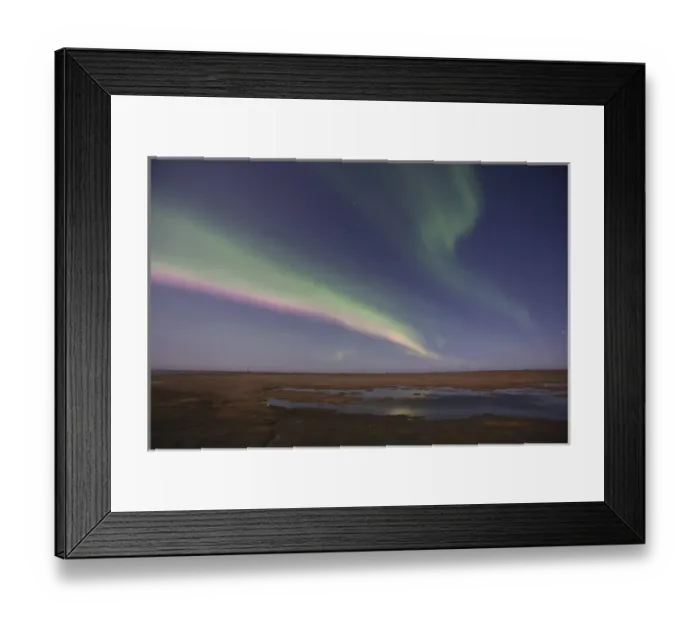 Framed Print : Curtains of colored northern lights (aurora borealis) dance in the night sky over Framed Print : Curtains of colored northern lights (aurora borealis) dance in the night sky over