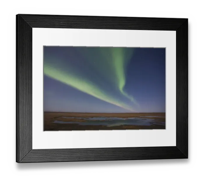 Framed Print : Curtains of colored northern lights (aurora borealis) dance in the night sky over