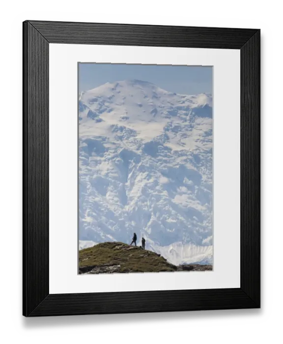 Framed Print : Hikers pause on a ridge in the Kantishna Hills with the Wickersham Wall of Mt