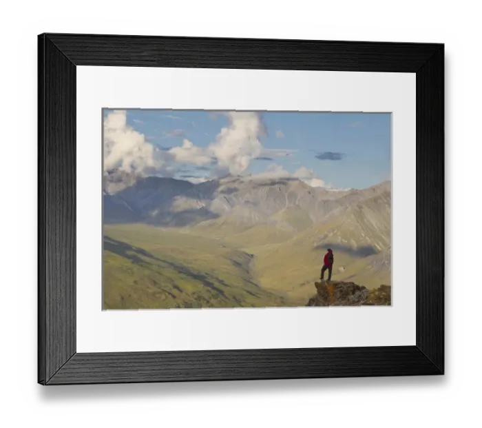 Framed Print : USA, Alaska, Arctic National Wildlife Refuge. Hiker pausing to admire hill scenery Framed Print : USA, Alaska, Arctic National Wildlife Refuge. Hiker pausing to admire hill scenery