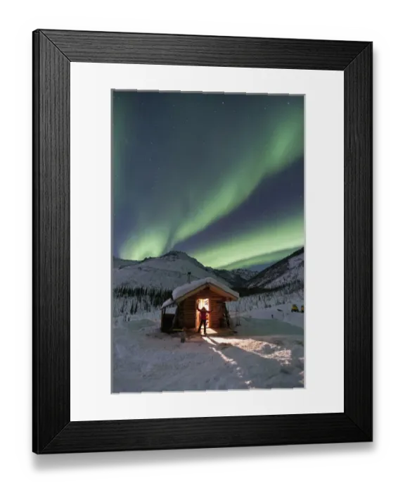 Framed Print : A person stands in the doorway of the Caribou Bluff cabin and watches in awe as Framed Print : A person stands in the doorway of the Caribou Bluff cabin and watches in awe as