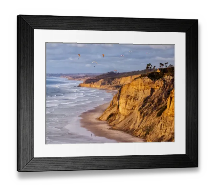 Framed Print : USA, California, La Jolla, Paragliders float over Blacks Beach in late afternoon