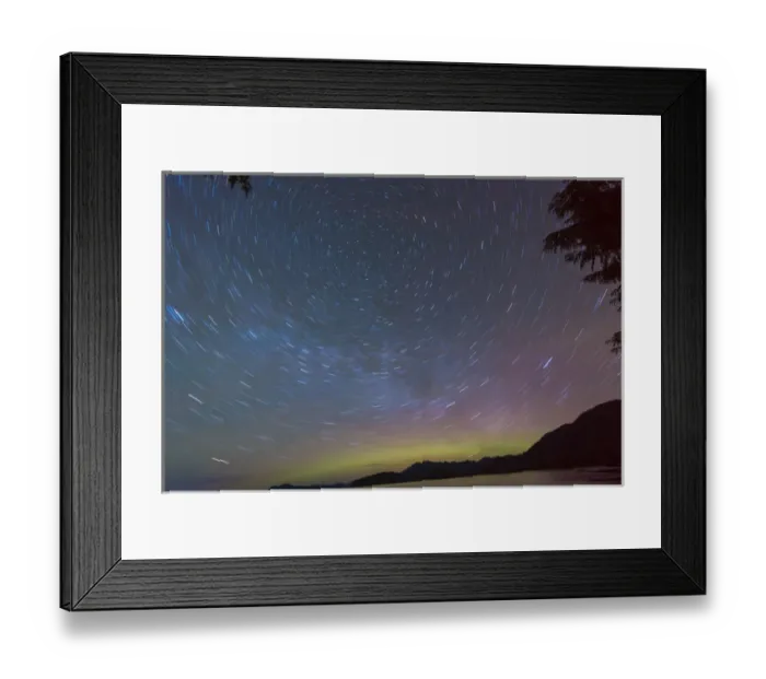 Framed Print : US, AK, Ketchikan. Northern Lights glow on horizon with star trails rotating around North Star