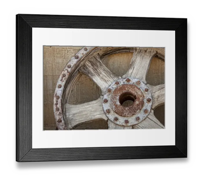 Framed Print : USA, California, Randsburg. Old wooden and metal wheel