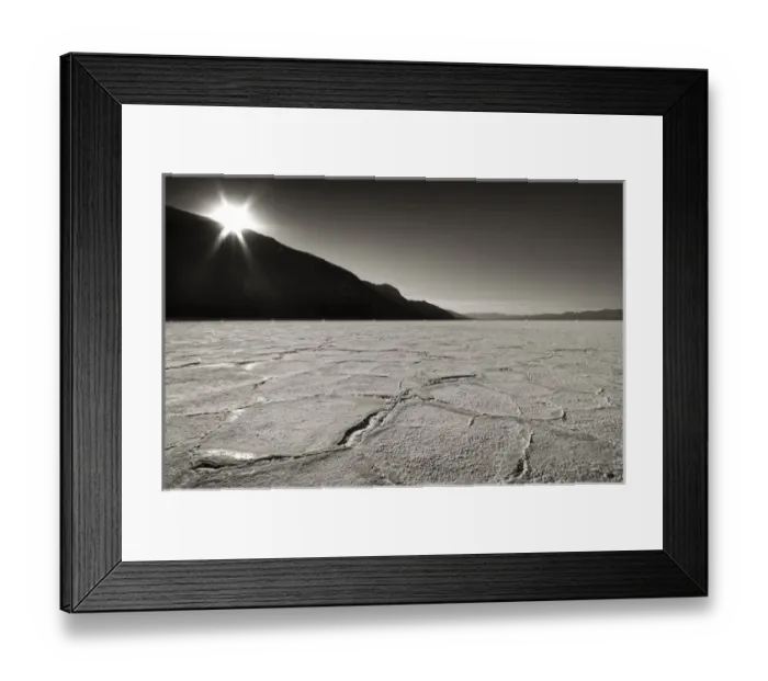 Framed Print : USA, California, Death Valley. Sunburst over salt pan of Badwater Basin. Credit as