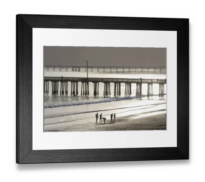 Framed Print : US, CA, Avila Beach. Silhouetted beach walkers approach pier end of day Framed Print : US, CA, Avila Beach. Silhouetted beach walkers approach pier end of day