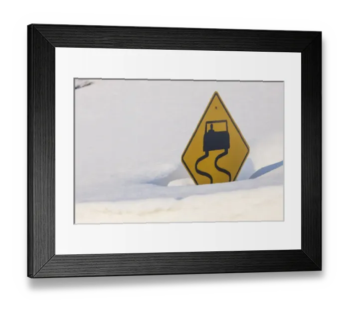 Framed Print : USA, Colorado. A slippery when wet sign buried in snow Framed Print : USA, Colorado. A slippery when wet sign buried in snow
