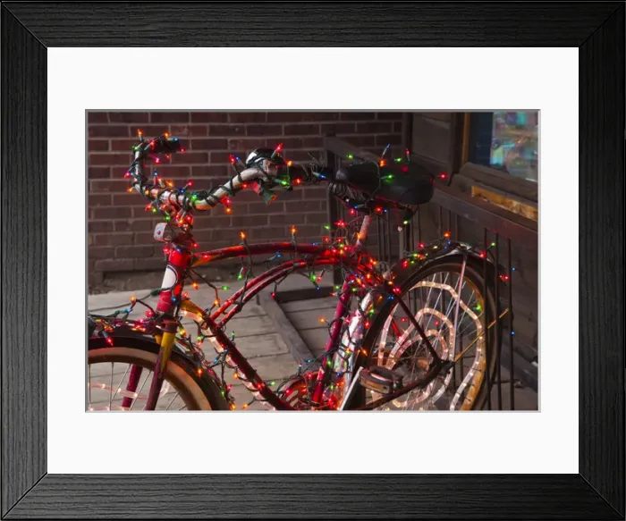 Framed Print : USA, Colorado, Crested Butte, Elk Avenue, bicycle covered in colored lights