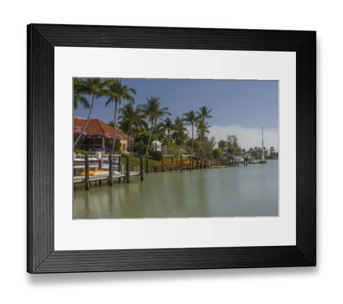 Framed Print : USA, Florida, Naples. Luxury homes in the Port Royal neighborhood line a canal by Framed Print : USA, Florida, Naples. Luxury homes in the Port Royal neighborhood line a canal by