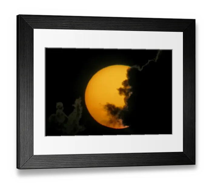Framed Print : USA, Florida, Fort De Soto Park. Dark clouds partially cover sun at sunset. Credit as