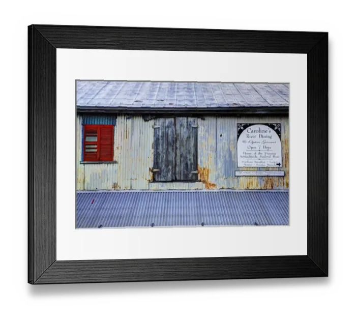 Framed Print : USA; North America; Florida; Apalachicola; Old tin building with red shutters Framed Print : USA; North America; Florida; Apalachicola; Old tin building with red shutters