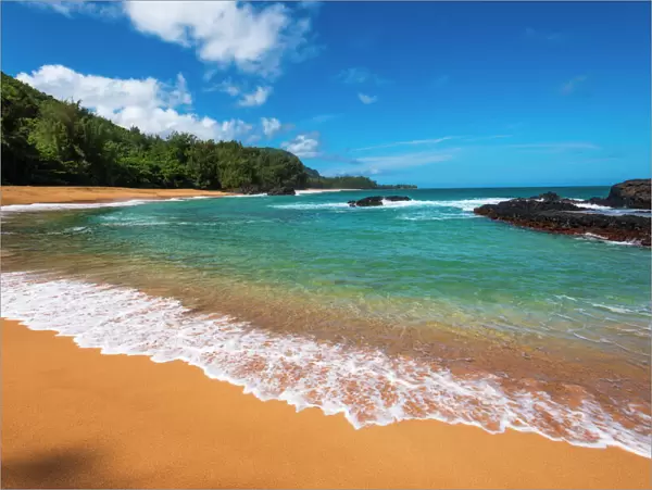 Sand and surf at Lumahai Beach, Island of Kauai, Hawaii USA