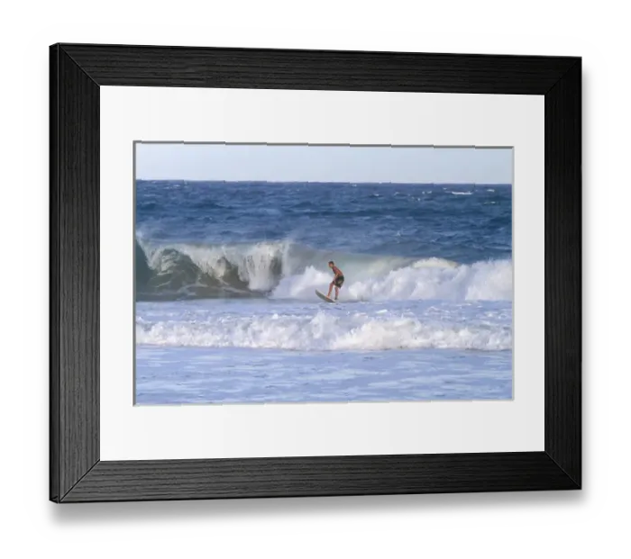 Framed Print : Surfer riding pacific ocean waves off the island coast of Kauai, Hawaii, USA