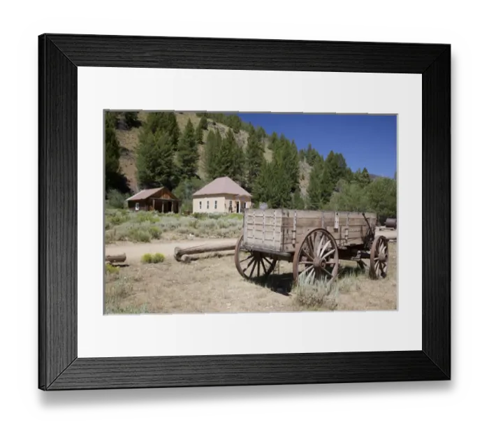 Framed Print : ID, Custer, (1880s gold mining town) Freight wagon; with schoolhouse / museum Framed Print : ID, Custer, (1880s gold mining town) Freight wagon; with schoolhouse / museum