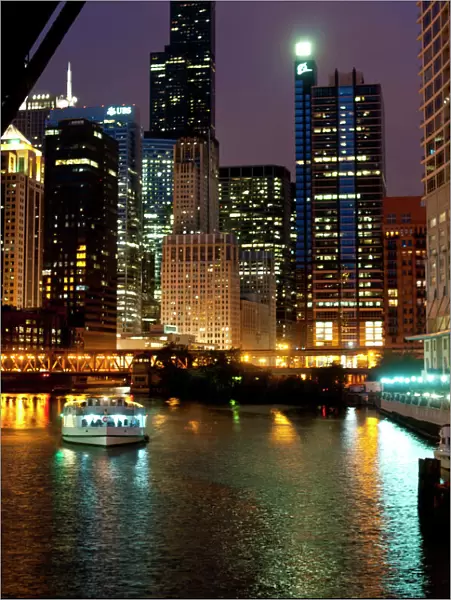 Chicago River and skyline at dusk with boat