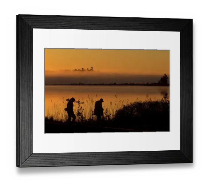 Framed Print : USA, Michigan, Drummond Island, Photographers after sunrise walking along Potagannissing