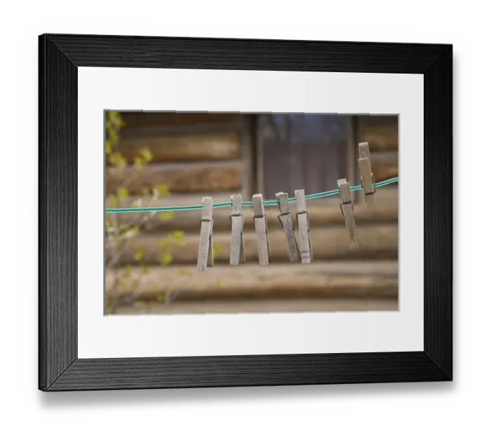 Framed Print : USA, Montana. Clothes pins on a clothesline outside log cabin Framed Print : USA, Montana. Clothes pins on a clothesline outside log cabin