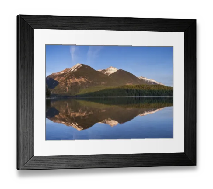 Framed Print : Swan Mountains reflect into calm Holland Lake at sunset in the Lolo National Forest