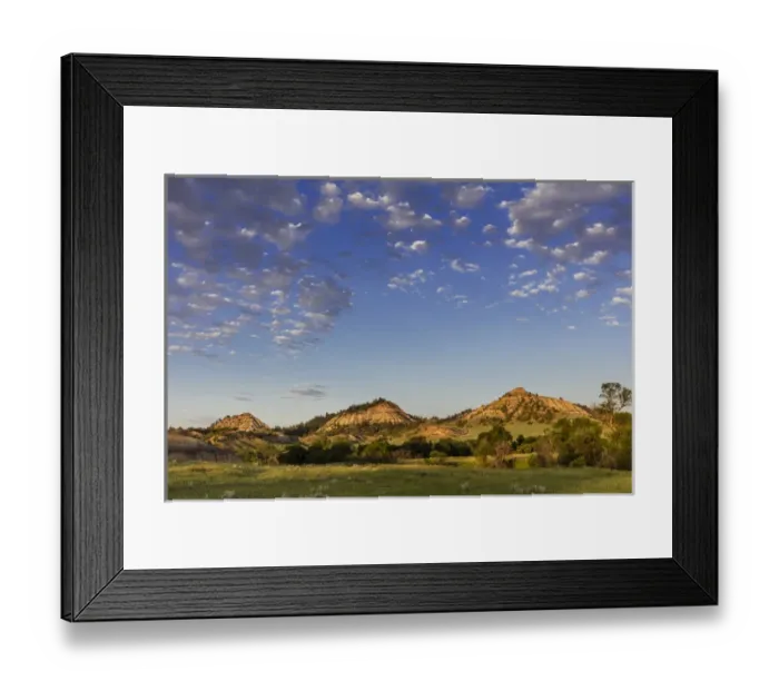 Framed Print : Late day light on badlands and ranch pastures near Miles City, Montana, USA Framed Print : Late day light on badlands and ranch pastures near Miles City, Montana, USA
