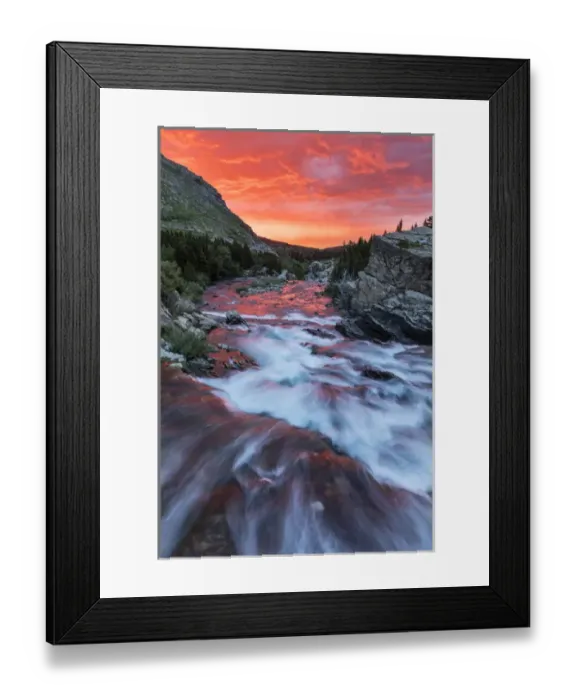 Framed Print : Brlliant sunrise sky over Swiftcurrent Falls in Glacier National Park, Montana, USA Framed Print : Brlliant sunrise sky over Swiftcurrent Falls in Glacier National Park, Montana, USA