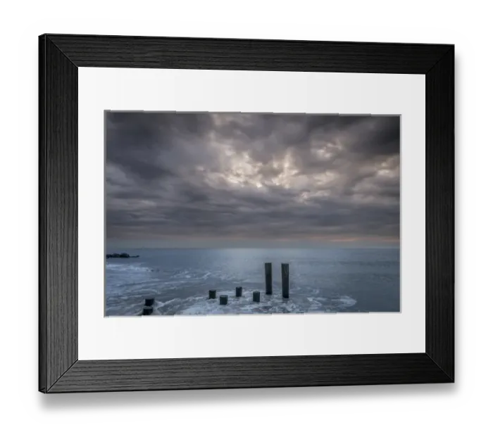 Framed Print : USA, New Jersey, Cape May National Seashore. Beach pilings on stormy sunrise. Credit as