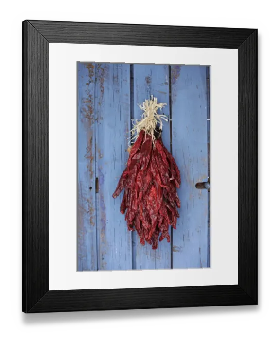 Framed Print : Santa Fe, New Mexico, United States. Traditional chili ristra hangs on door