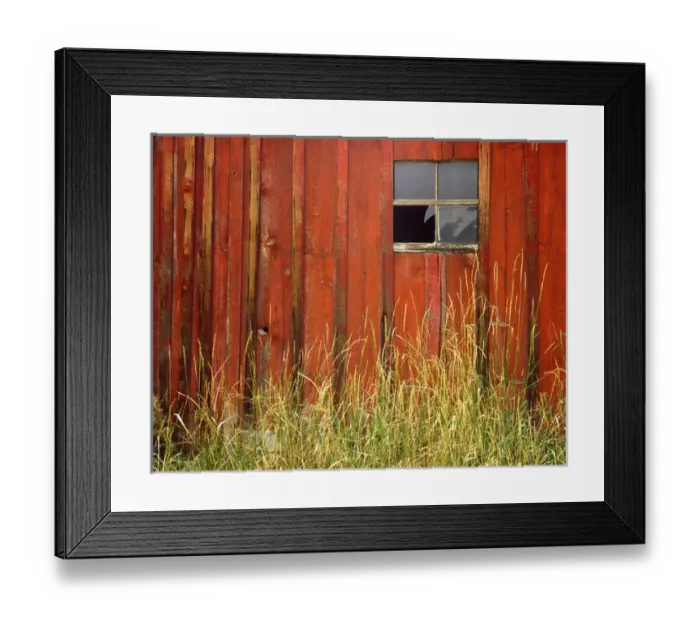 Framed Print : USA, Oregon, Joseph, Grasses contrast with broken window on side of rustic red barn in autumn