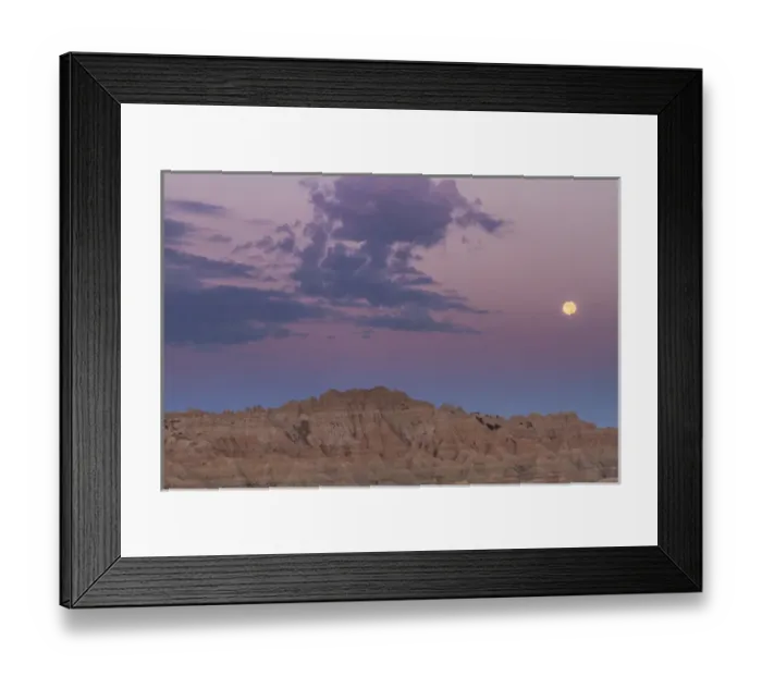 Framed Print : USA, South Dakota, Badlands National Park. Sunrise and moonset over rugged landscape