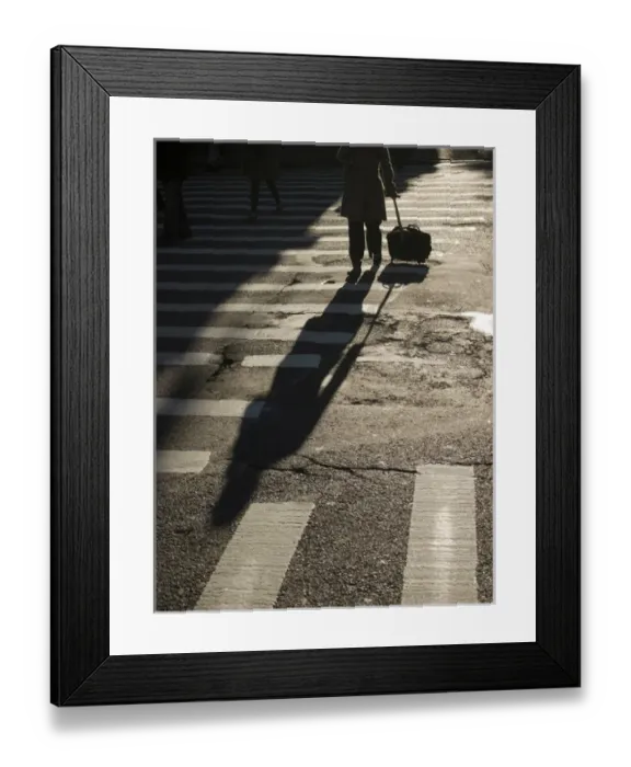 Framed Print : New York, New York, United States A woman rolls her suitcase across a street Framed Print : New York, New York, United States A woman rolls her suitcase across a street